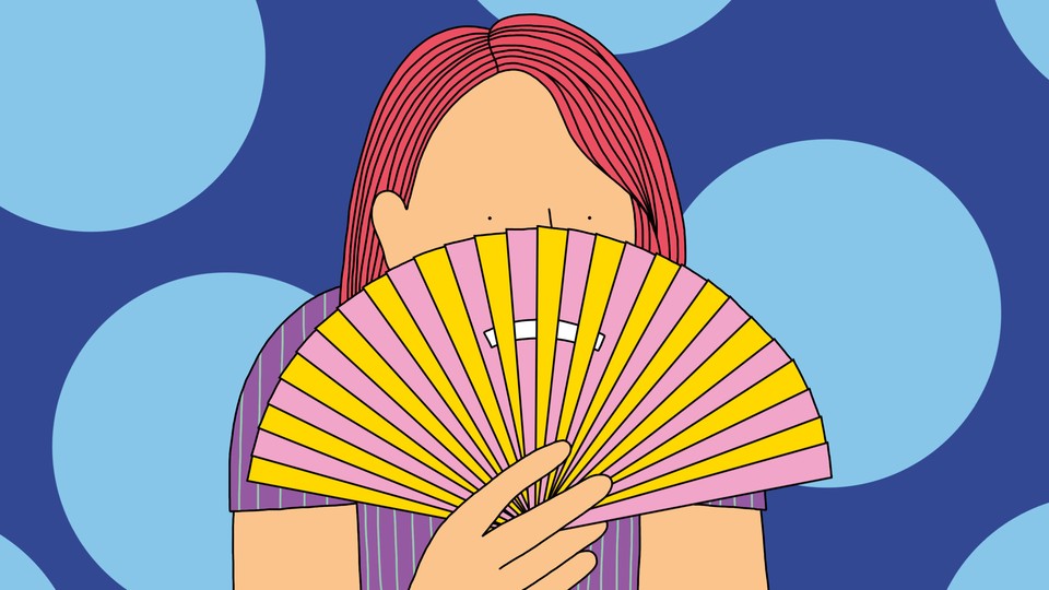 A person hides their face using a fan with a frown on it.