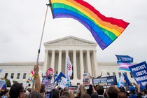 A gay-pride flagging waving in front of the Supreme Court