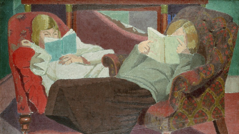 Two girls reading books