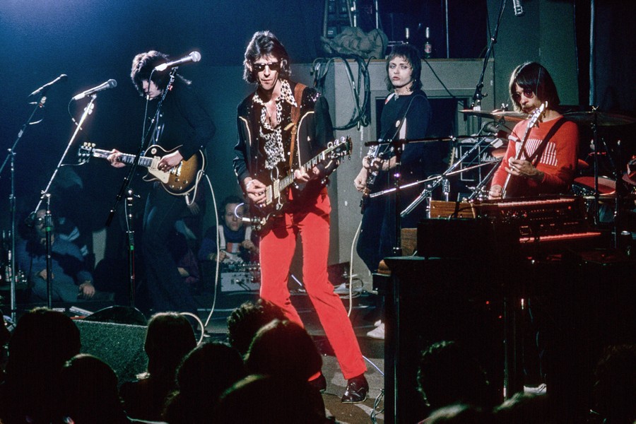 The rock band The Cars performs on stage.