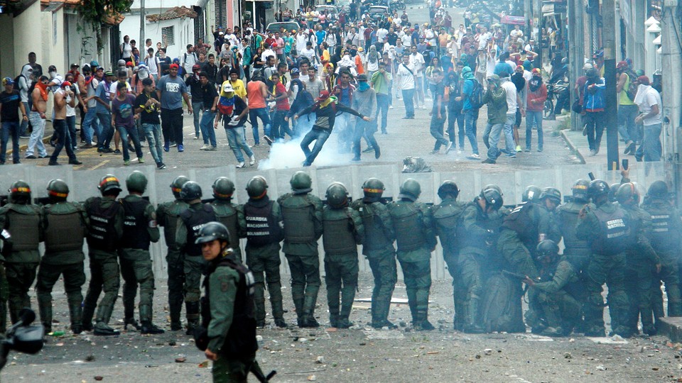 Demonstrators clash with members of Venezuelan National Guard