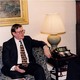 David Trimble sits on a sofa across from Bill Clinton