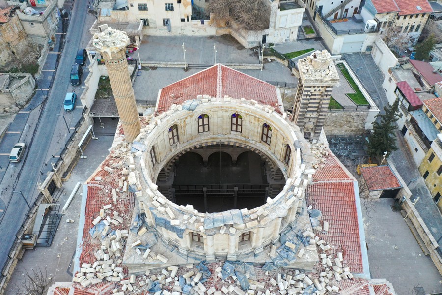 An aerial view of a quake-damaged mosque, where the main dome has collapsed