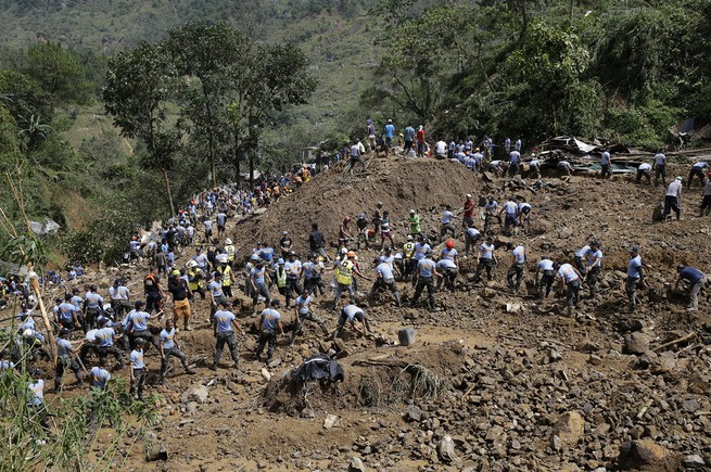 Rescuers search for victims believed to have been buried by a landslide in Itogon, Philippines, on September 17, 2018 after Super Typhoon Mangkhut.