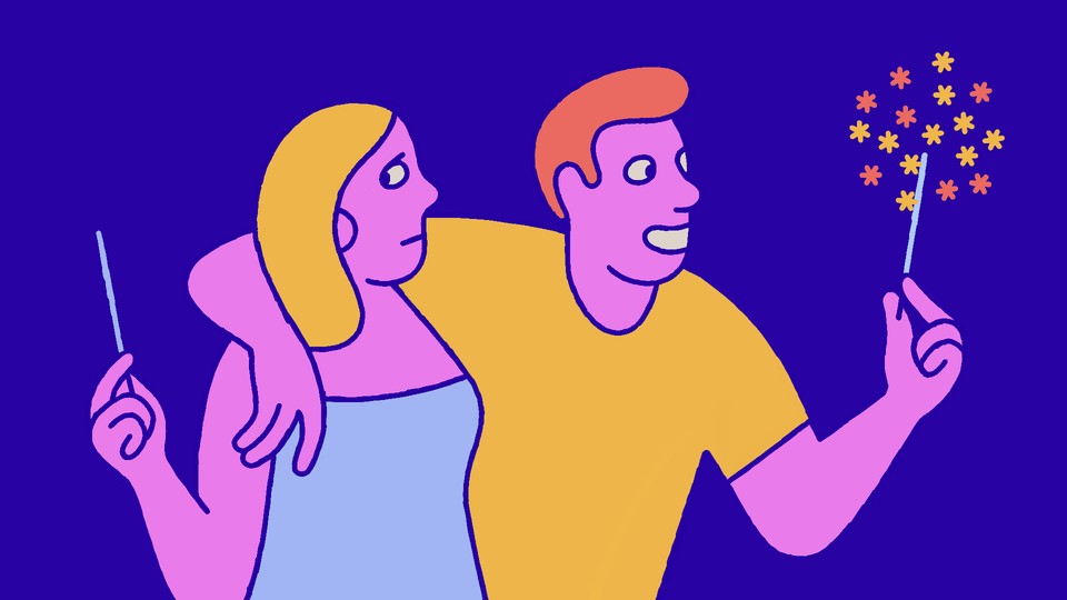 A skeptical-looking woman holding an unlit sparkler, being embraced by a happy man whose sparkler is lit