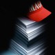 A pile of confidential documents covered by a MAGA cap