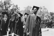 College students wearing caps and gowns, during a graduation ceremony in 1991. 