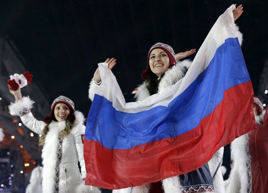 Sochi, Russia. 12th February 2014. A Spectator wears a drinking