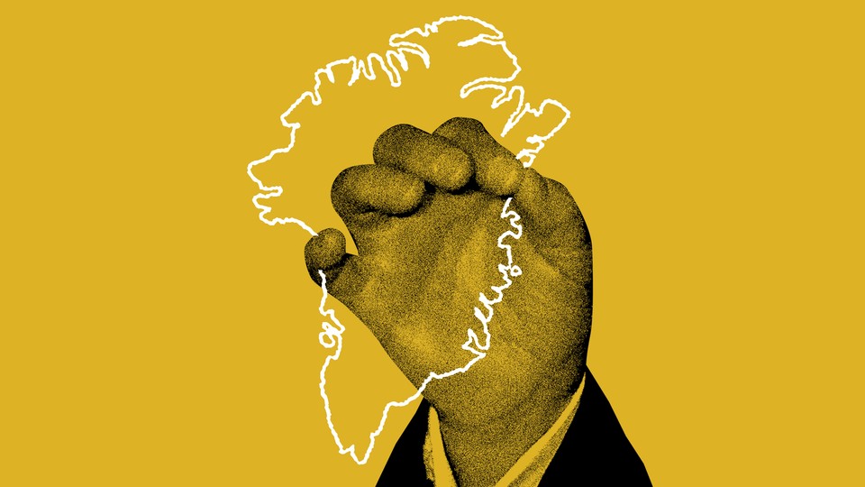 A hand holding a Greenland-shaped polygon