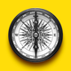 Illustration of a black compass pointing North in front of a yellow background
