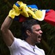 Leopoldo López displays the Venezuelan national flag.