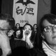 Frustrated voters standing in front of an Iowa flag