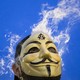 Member of Anonymous movement wearing Guy Fawkes mask