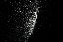 Salt sprinkled against a black background