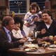 Roseanne and her family around the dinner table in 'Roseanne'