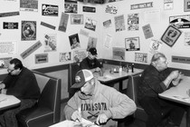 A diner full of people eating alone