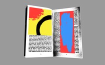 An illustration of a book with colorful illustrations: a red blotch and black circle against a yellow background on one page, and a blue smear against red on the other