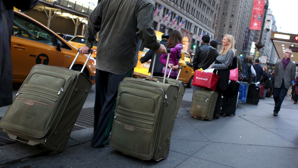 People pulling suitcases