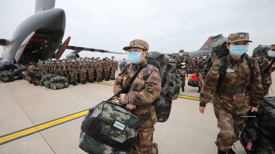 Medical personnel are transported by People's Liberation Army aircraft.