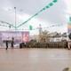 A coffin is paraded before a gathering that includes Hamas members.