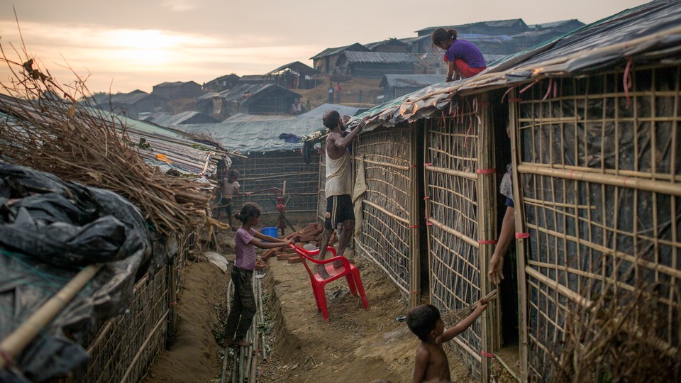 Rohingya refugees fix their temporary shelter at a camp in Cox's Bazar.