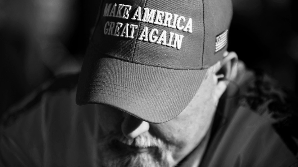 Man wearing a "Make America Great Again" hat