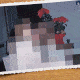 A family sitting on a couch comes into focus from a pixelated view.