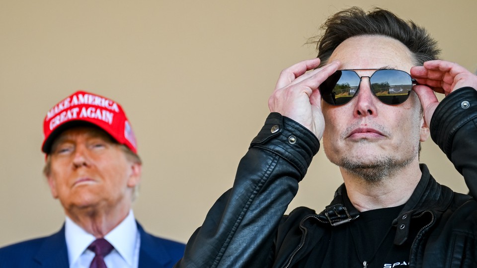 Photo of Elon Musk putting on sunglasses, with Donald Trump, wearing a MAGA hat, in the background