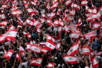 Demonstrators wave Lebanese national flags