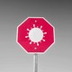 A coronavirus on a red stop sign