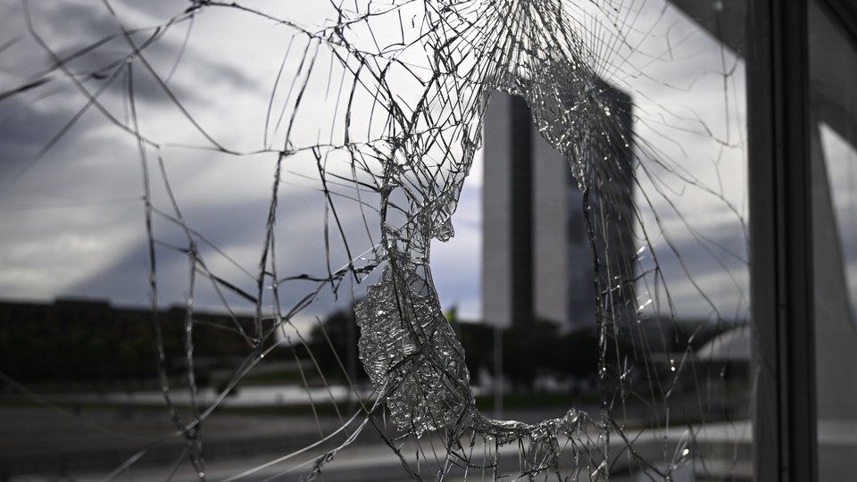 A broken window at Planalto Palace in Brasilia, Brazil