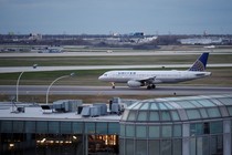  A United Airlines aircraft lands at O'Hare International Airport in Chicago, Illinois on April 11, 2017. 