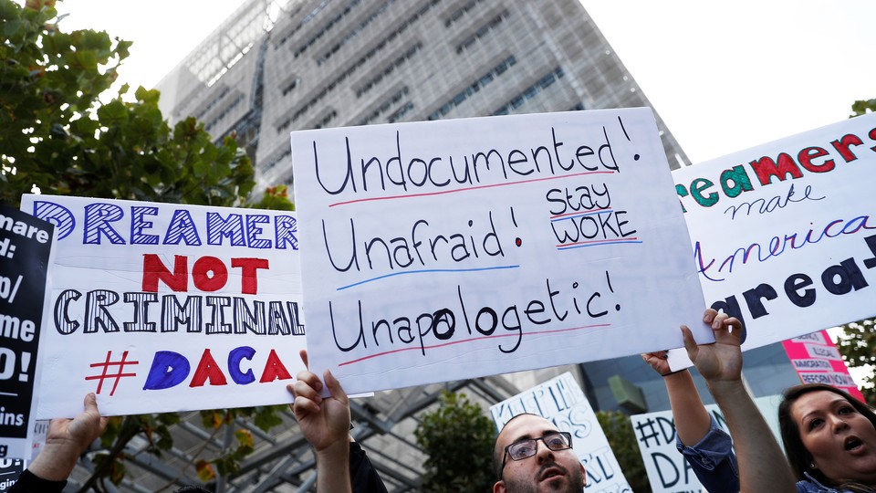 Demonstrators rally against the rescindment of DACA outside the San Francisco Federal Building on September 5. 