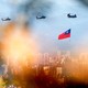 Military helicopters carrying Taiwan flags conduct a flyby rehearsal ahead of National Day celebration, near Taipei 101 , amid escalating tensions between Taipei and Beijing, China, in Taipei, Taiwan, on October 5, 2021.