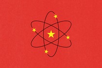Illustration of the national flag of China, but with the yellow stars rearranged on an atomic symbol