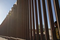 A child, a resident of Ciudad Juarez, Mexico, looks through the bars of a wall from the side of Ciudad Juarez, in this picture taken on the side of El Paso, Texas, U.S. May 25, 2019.