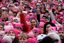 a crowd of women wearing pink hats