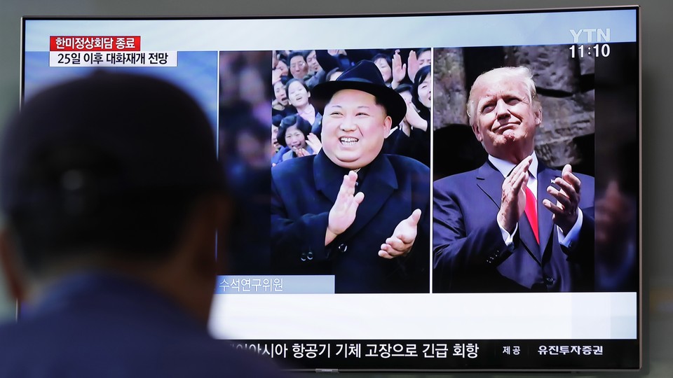 Kim and Trump on a TV screen