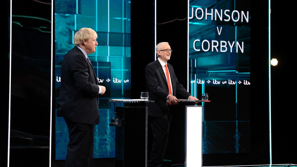 Boris Johnson and Jeremy Corbyn stand in front of lecterns during a TV debate.