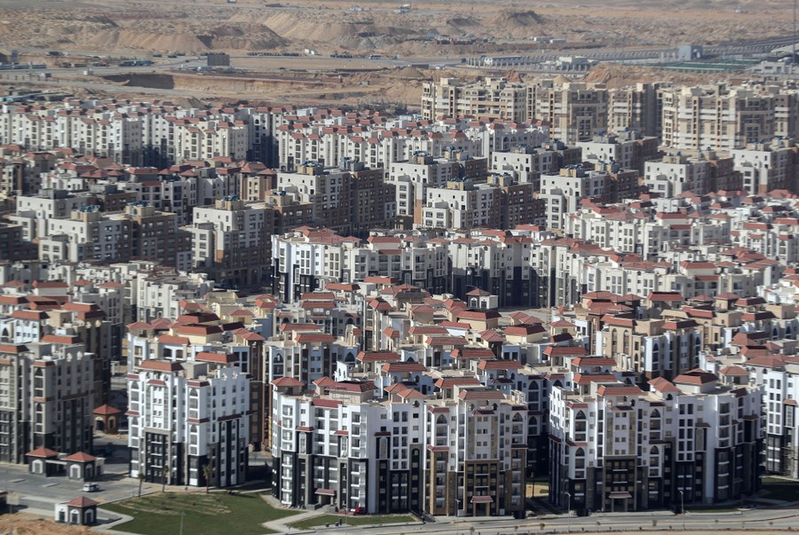 An elevated view of a large cluster of new apartment buildings