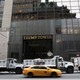 Dump trucks form a protective cordon around Trump Tower during an August visit by the president.