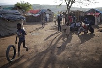 A boy plays at a refugee camp for Haitians returning from the Dominican Republic on the outskirts of Anse-a-Pitres, Haiti, September 7, 2015.