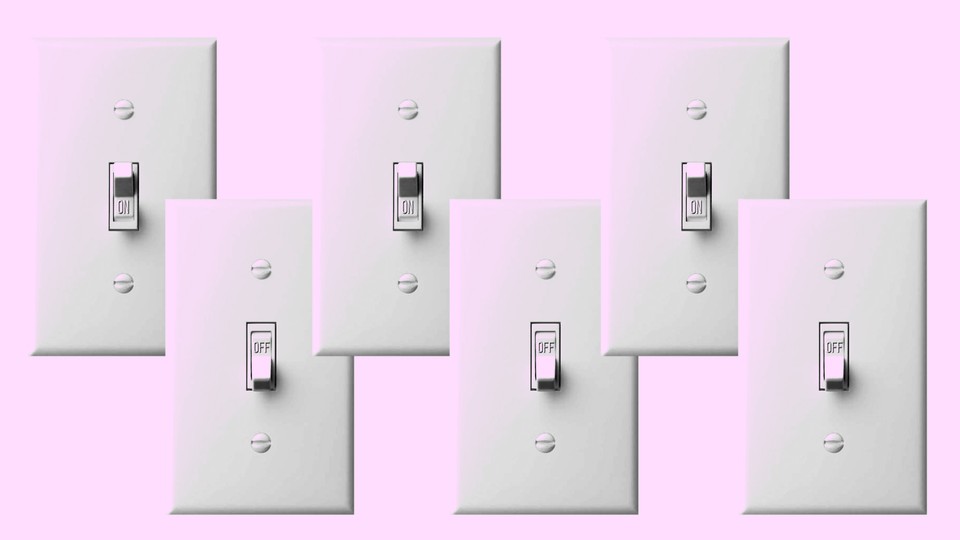 A row of light switches in on and off positions