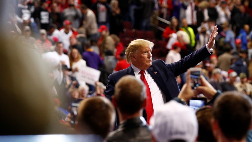Donald Trump waves to the crowd during a campaign rally.