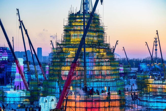 Workers build ice structures for the 25th Harbin Ice and Snow World, in China