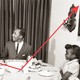 A family sits down to Thanksgiving dinner, while a red graph line dips and then shoots up.