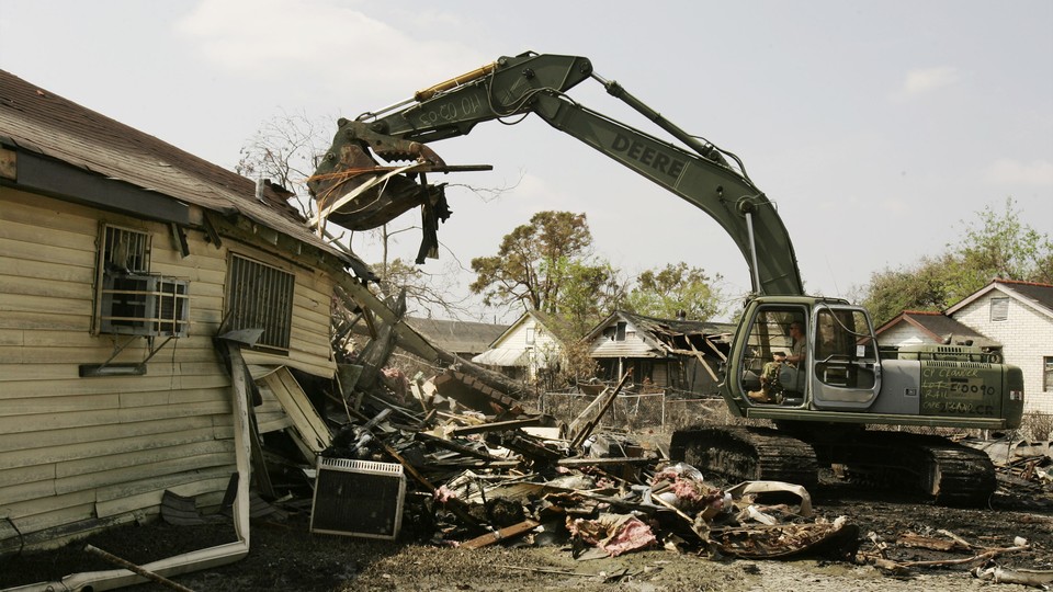 Members of the National Guard clear debris from the roads in New Orleans on September 15, 2005