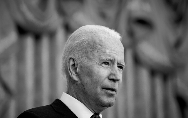 Joe Biden looks out from a podium.