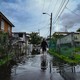 A man walks through the flooded neighborhood of Juana Matos in Catano, Puerto Rico, on September 19.