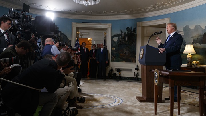 Camerapeople taping President Trump speaking